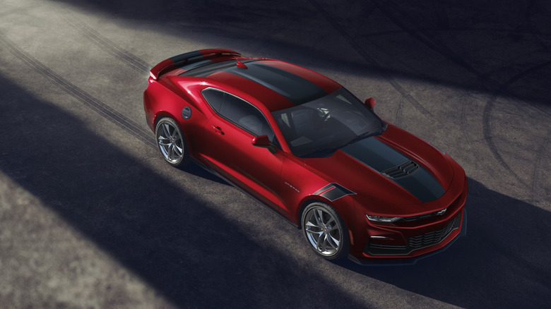 A red 2021 Chevrolet Camaro on pavement.