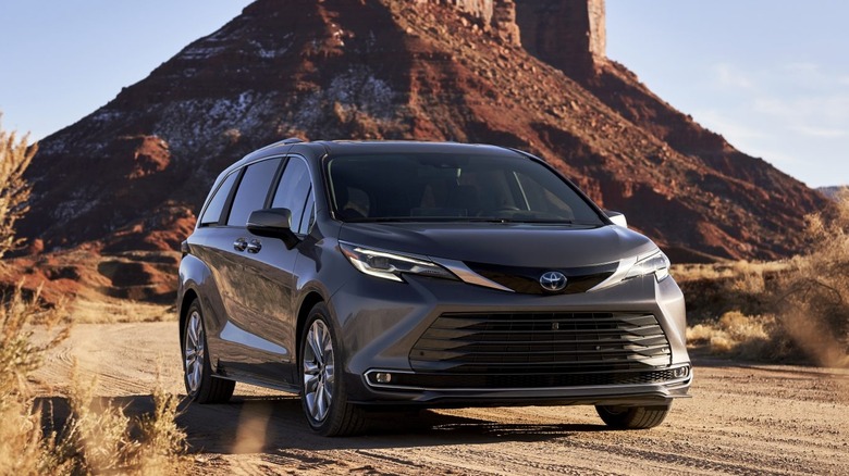 A gray 2021 Toyota Sienna on a dirt road.