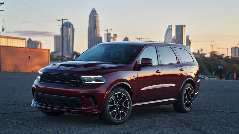 A 2021 Dodge Durango SRT Hellcat parked with a city in the background