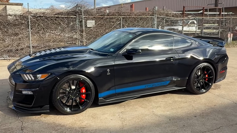 A black 2021 Ford Mustang Shelby GT500KR parked in front of the Carroll Shelby Heritage Center in Las Vegas