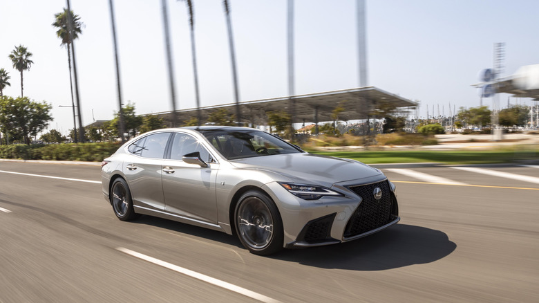 A silver 2021 Lexus LS 500 on a roadway.