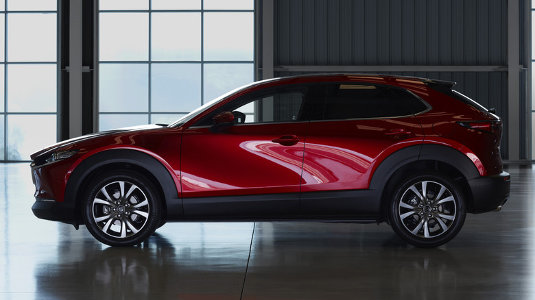 Side profile view of a red 2021 Mazda CX-30