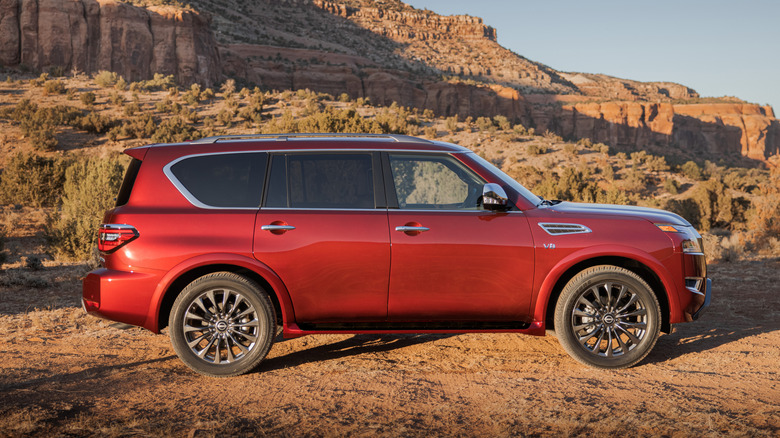 A red 2021 Nissan Armada in front a mountain.