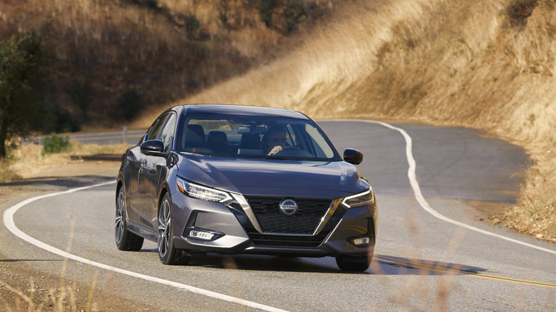 A gray 2021 Nissan Sentra on a road.