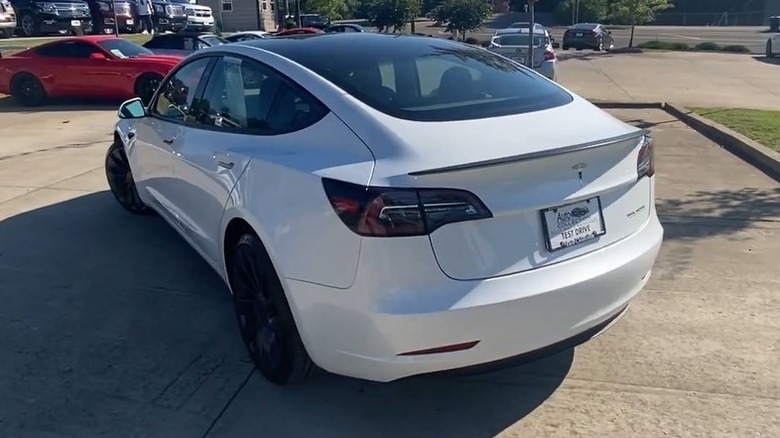 Rear 3/4 shot of a white 2021 Tesla Model 3 Performance