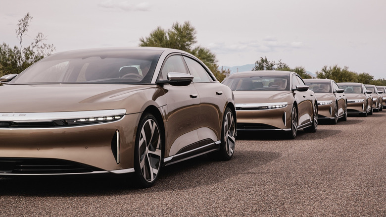 Multiple Lucid Air sedans parked in a row.
