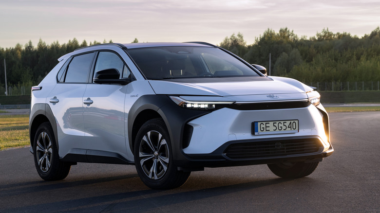 Photo of a Toyota bZ4X all-electric crossover with trees in the background