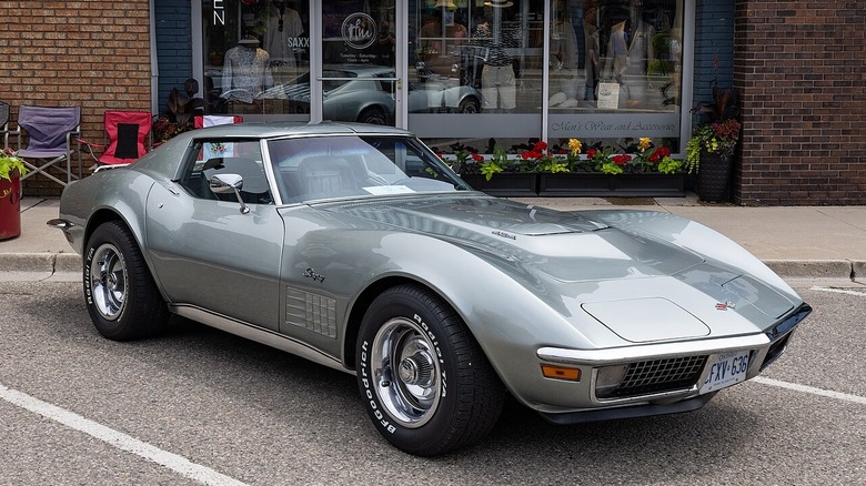 A front-quarter view of a silver 1970s C3 Corvette