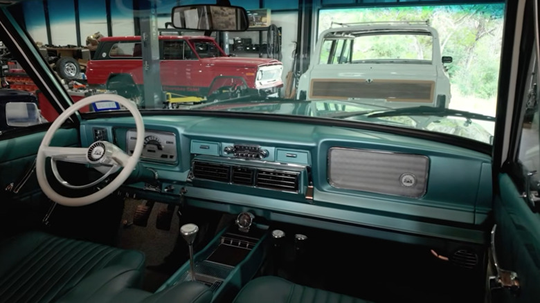 The interior of a 1966 Jeep Super Wagoneer facing the dashboard