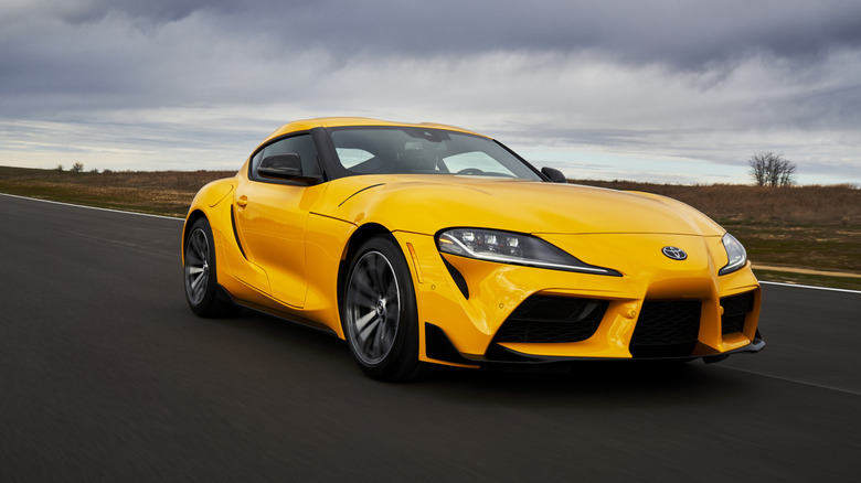 A yellow 2021 Toyota GR Supra on a track