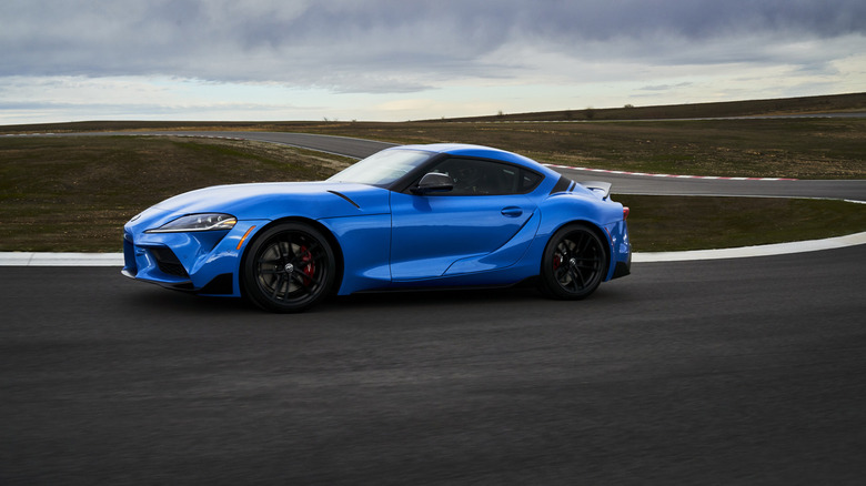A blue 2021 Toyota GR Supra on a race track