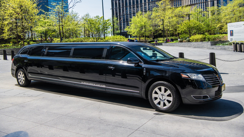 A Lincoln MKT limousine parked outside a building