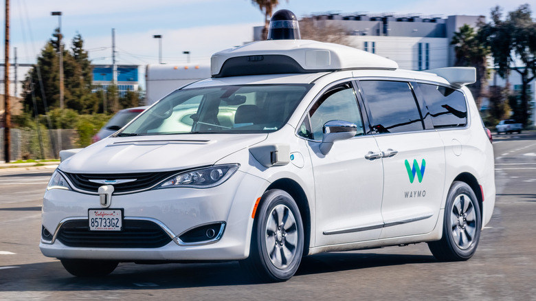 Front-quarter shot of a self-driving Waymo minivan