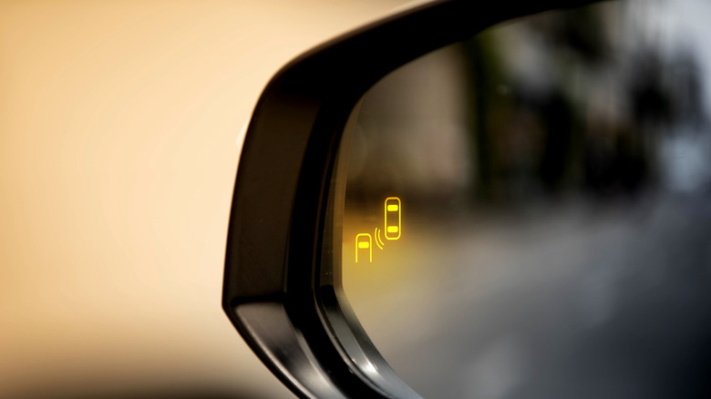 Blind Spot Monitoring System warning on side mirror