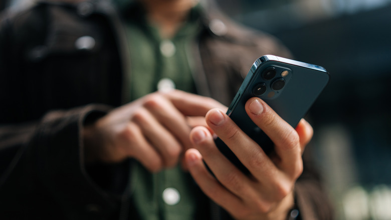 A man using a smartphone.