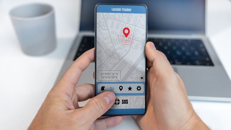Man tracking someone else's location with his smartphone