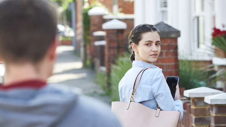 Young woman being stalked