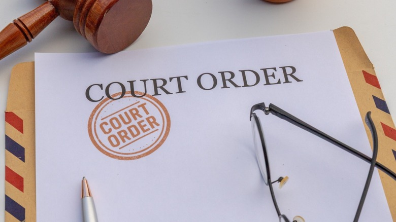 Paper that reads "Court Order"