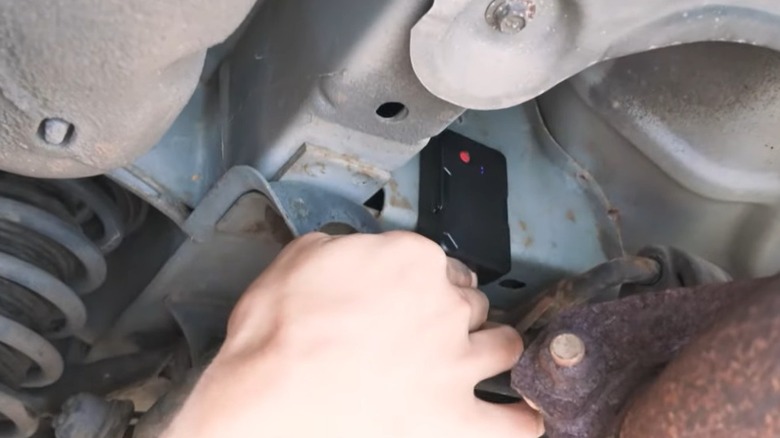 Magnetic tracking device placed under car