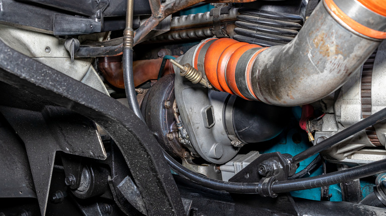 A turbocharger inside an engine bay