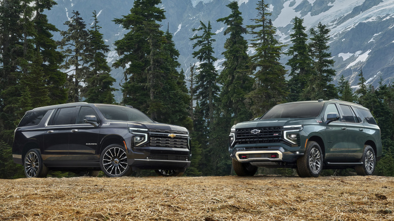 2025 Chevrolet Suburban and Tahoe against a scenic backdrop