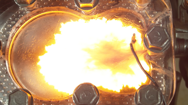 A working model showing how air-fuel mixture is ignited inside a gasoline combustion chamber