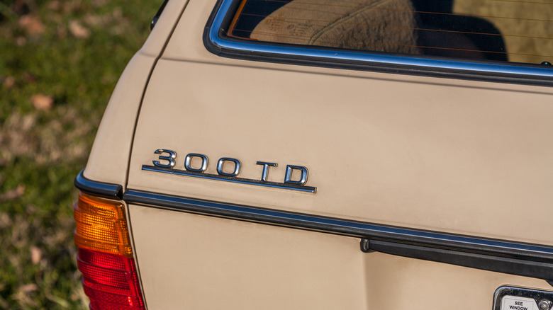 Close-up of a 300TD badge of a W123 wagon