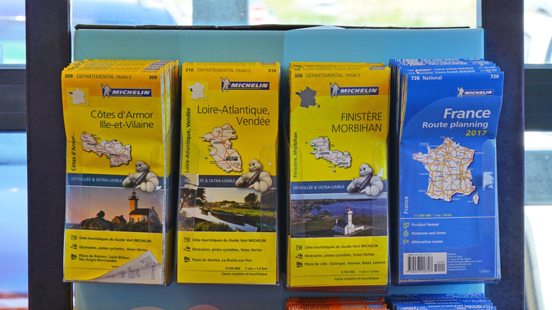 Selection of Michelin maps in a rack in a store