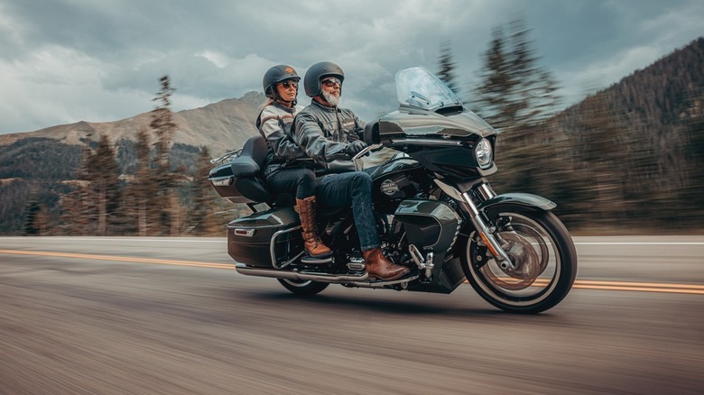 A man and woman riding in tandem on a 2026 Harley-Davidson Street Glide Limited