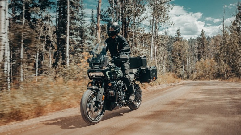 A rider standing on a 2026 Harley-Davidson Pan America 1250 Limited