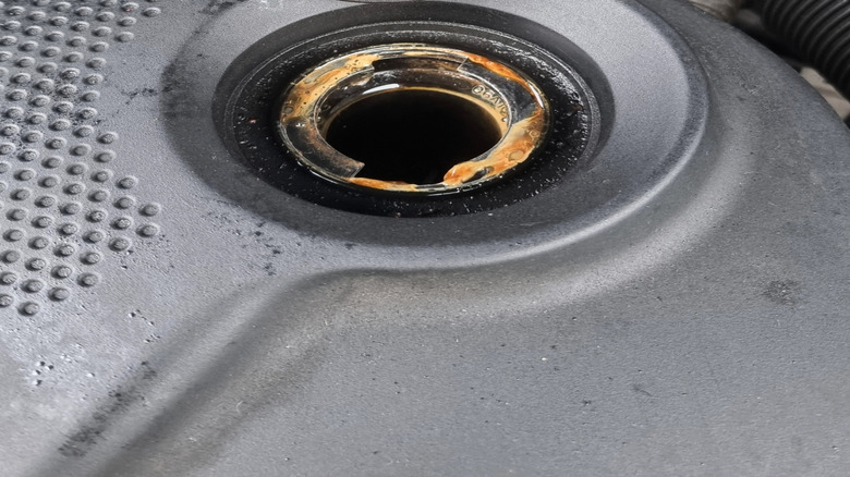 Whitish, frothy oil under the engine oil cap of a motor with head gasket leaks