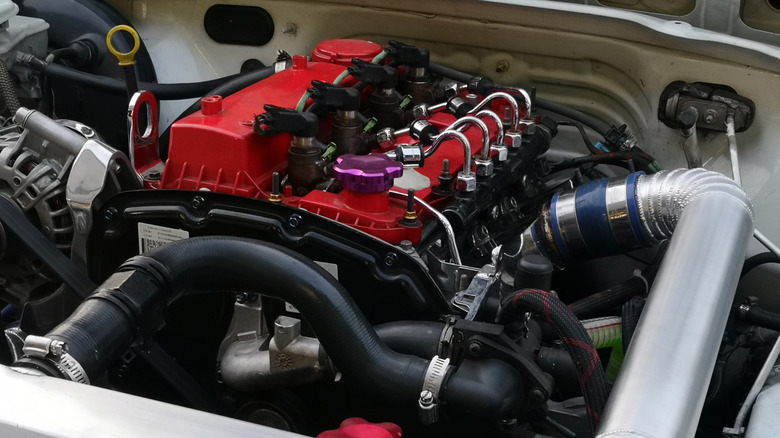 A four-cylinder diesel engine inside of a car