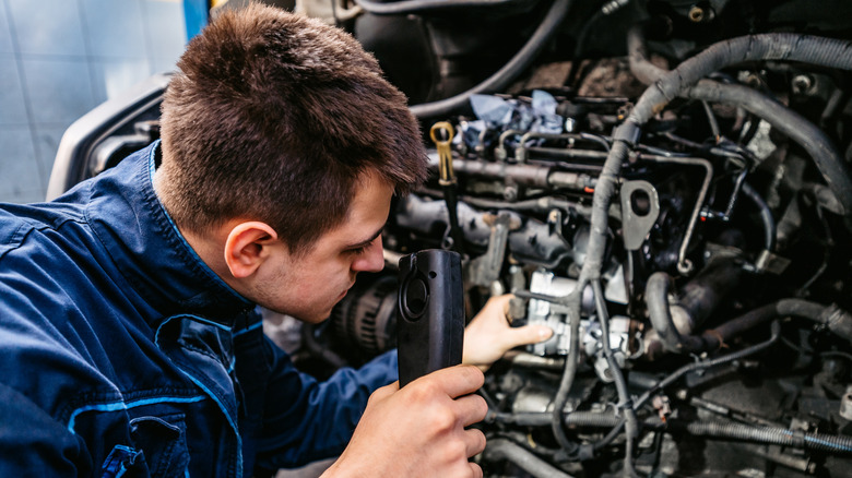 A diesel engine being inspected