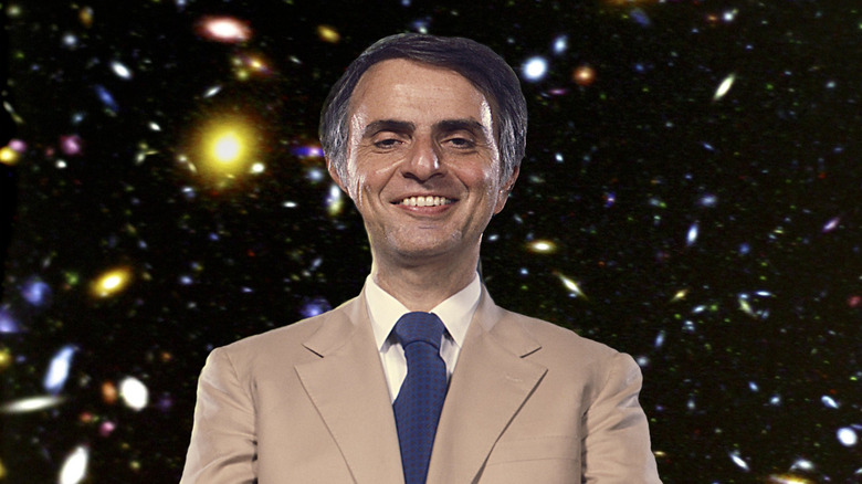 The legend, Carl Sagan, against a cosmic background