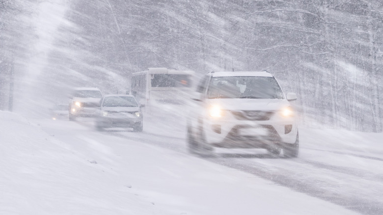 Vehicles driving through a blizzard