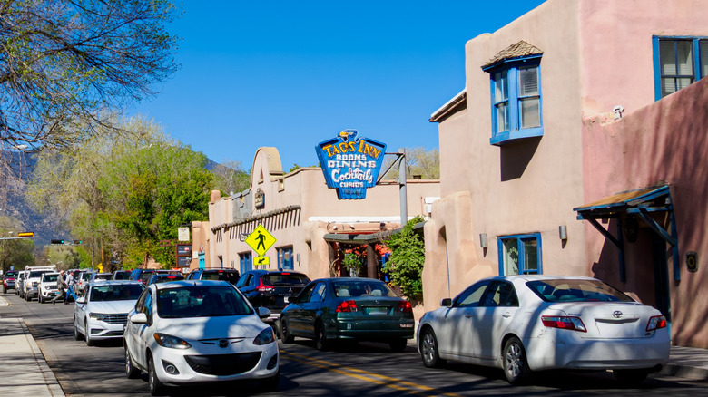 Cars sit in traffic on a street in Taos, New Mexico.