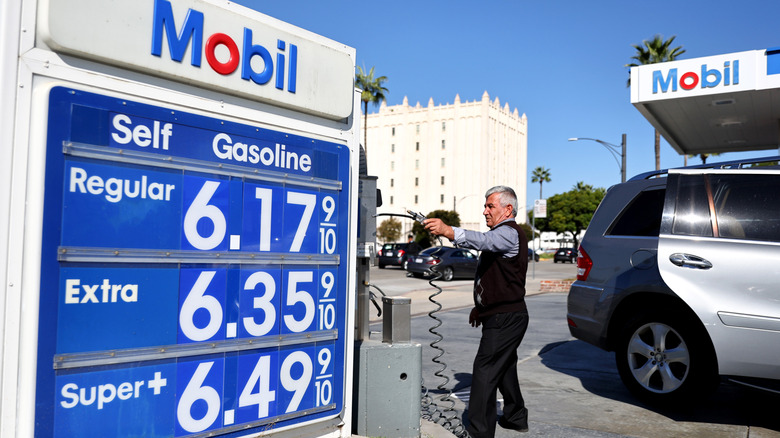The Mobil logo and gas prices are displayed at a Mobil gas station on October 28, 2022 in Los Angeles, California.