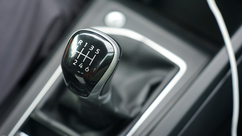 A manual transmission shifter in a car interior