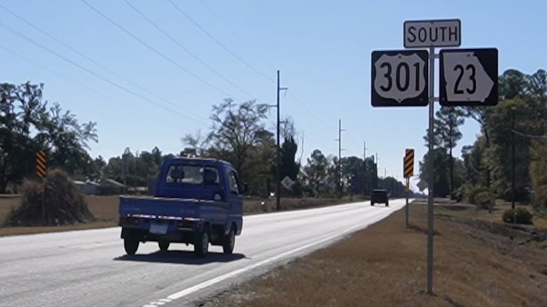 A blue Honda Acty kei truck extremely out of place on U.S. 301 and Georgia State Route 23