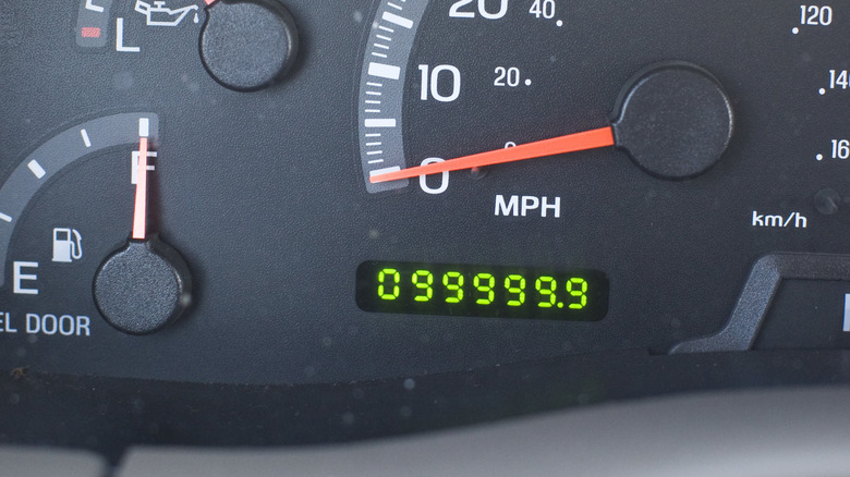 The odometer of an old Ford SUV with almost 100,000 miles on the reading