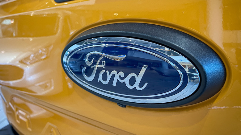 The modern Ford logo on the emblem of a Ford Ranger tail gate.