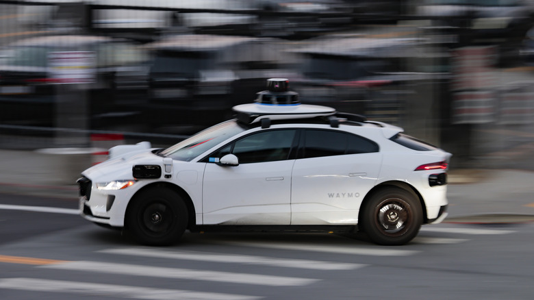 SAN FRANCISCO, CALIFORNIA - OCTOBER 08: An automobile operating under Alphabet's Waymo autonomous driving technology navigates a city street on October 08, 2026 in San Francisco, California. Waymo, which operates a fleet of roughly 3,871 to 4,000 vehicles across multiple U.S. metropolitan areas, closed a $5 billion term loan on Thursday to fund its global expansion. (Photo by Heather Diehl/Getty Images)