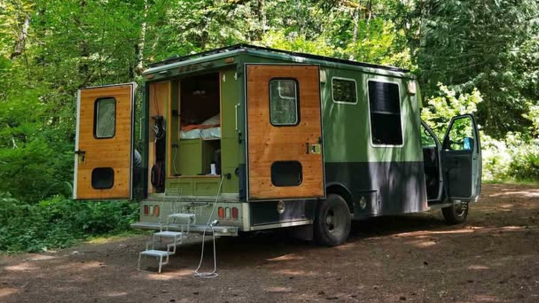 Green ambulance converted into a camper