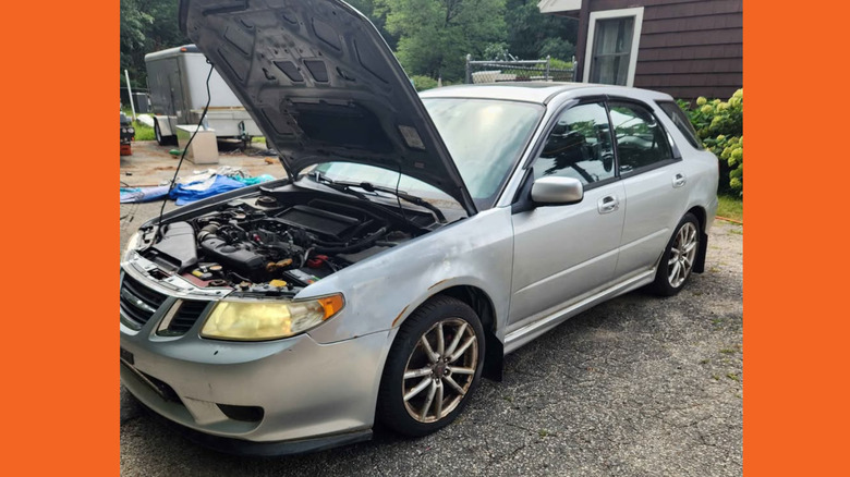 Silver Saab 9-2x Aero with its hood open