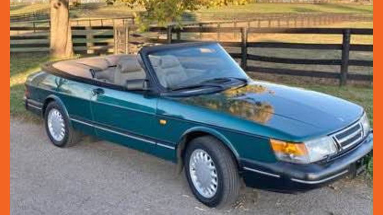 A very pixellated green Saab 900 convertible