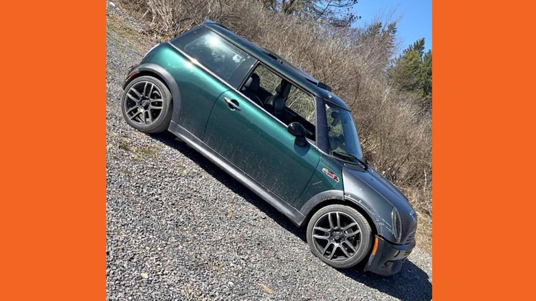 A green and silver Mini Cooper
