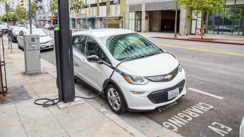 Los Angeles, CA, USA - October 15, 2022: BlueLA Blink mobility sharing system electric car being recharged in a car sharing location in downtown