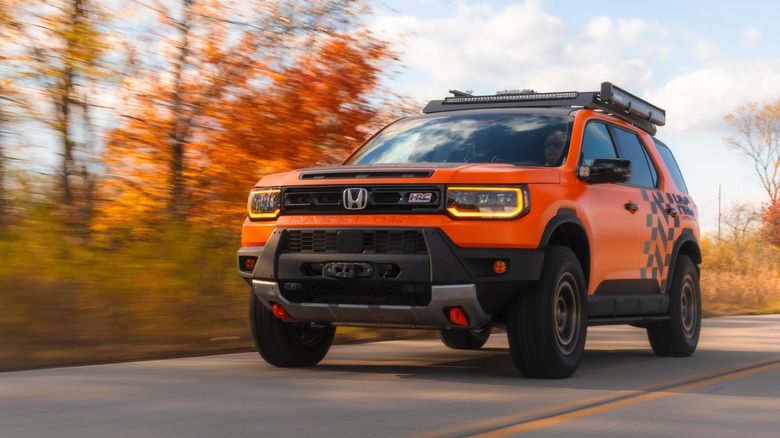 Front view of a Honda HRC Passport TrailSport concept SEMA build driving down a road