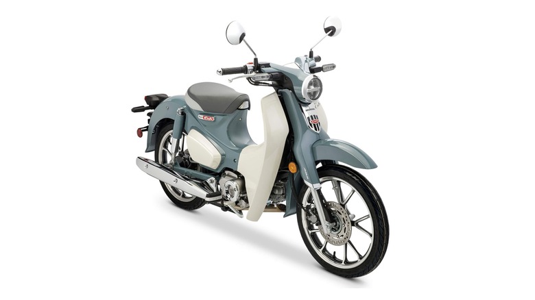 2024 Honda Super Cub C125 frontal close up of the LED headlights and turn signals.