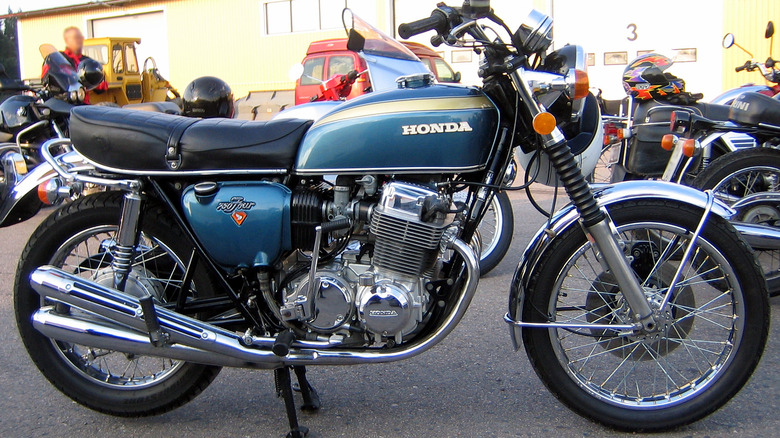 A rare blue 1969 Honda CB750 with a sandcast engine on display at a bike show.